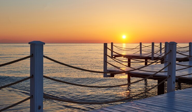 Wooden pier on a fancy orange sunset